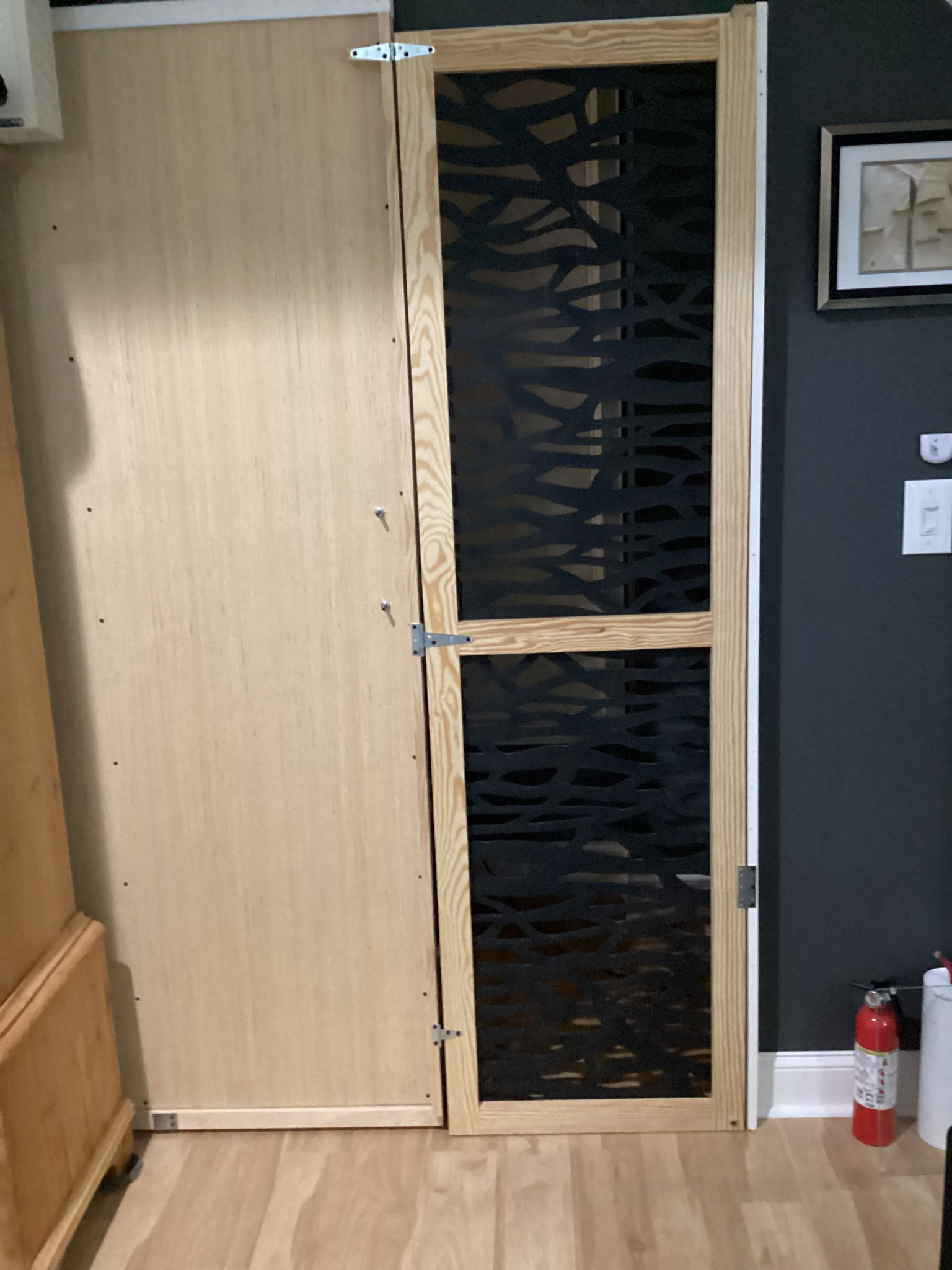 Added a porous door appendage so the air could circulate when room was not in use. The cold air return is out in the hallway and this cat-proofs the room. Shown in flow position