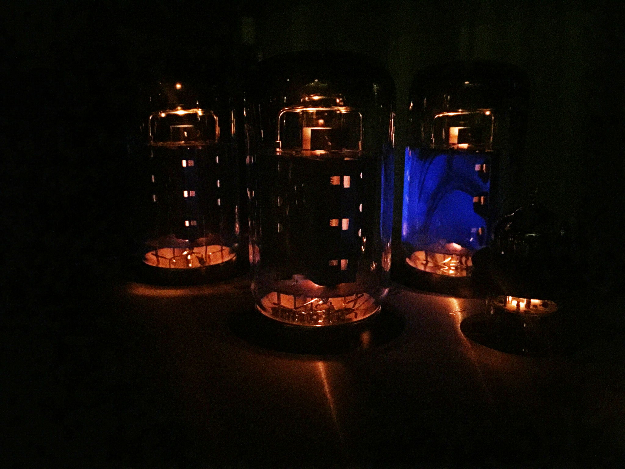 Power amp valves (tubes) glowing in the dark.