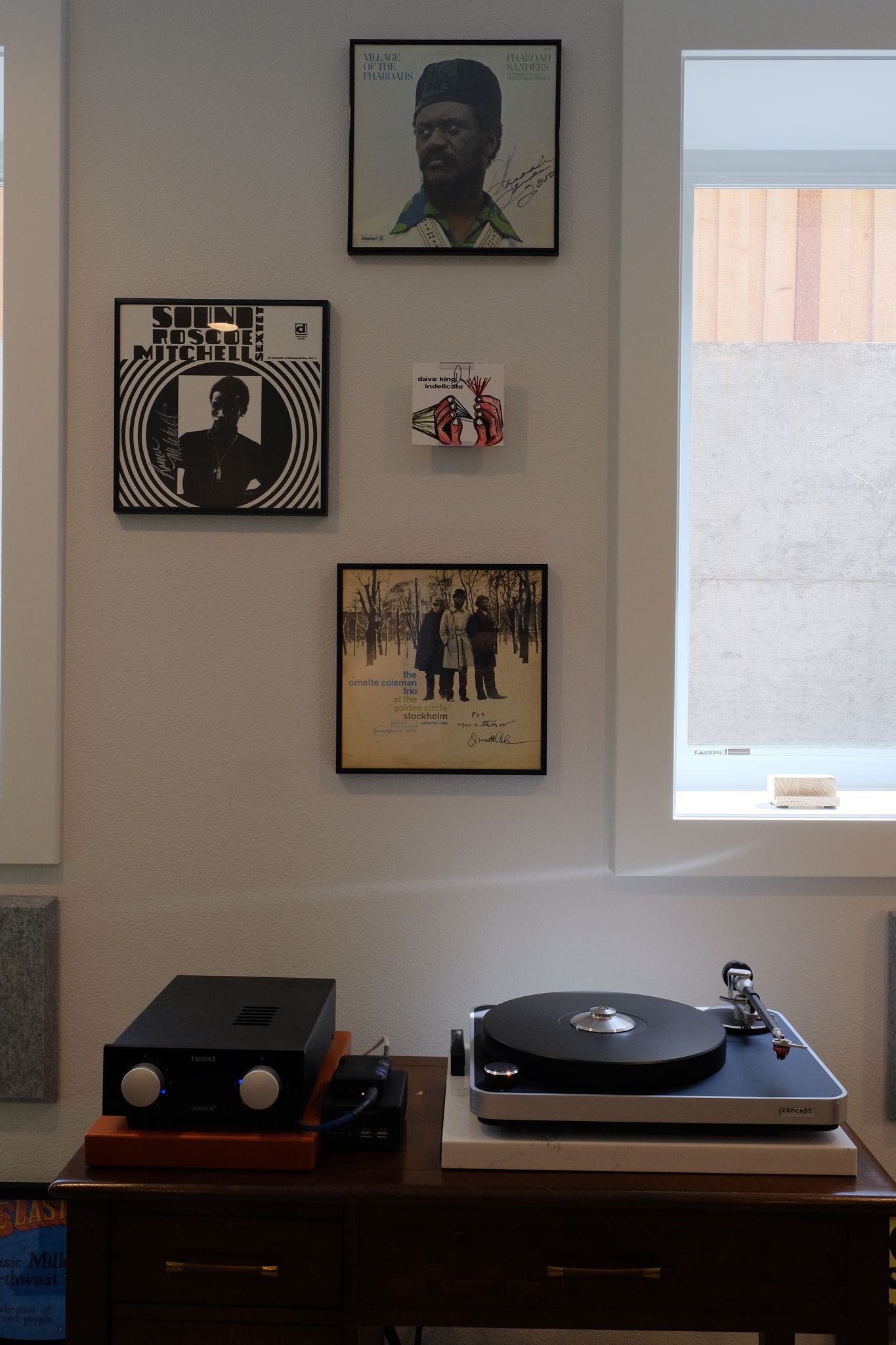 Autographed Albums by Ornette Coleman, Roscoe Mitchell, Pharaoh Sanders, and Dave King watch over.