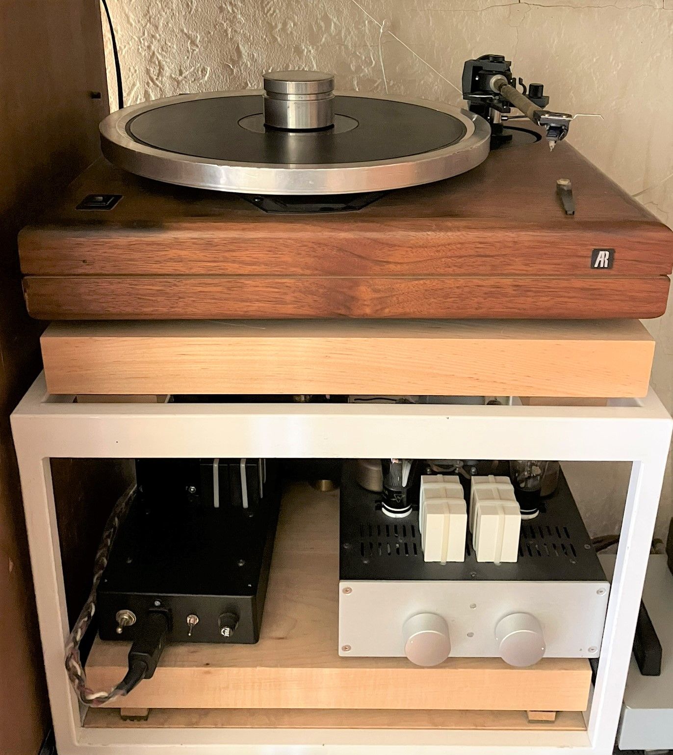 Analog playback components on a Target wall fixture fitted with maple butcherblock shelves. 