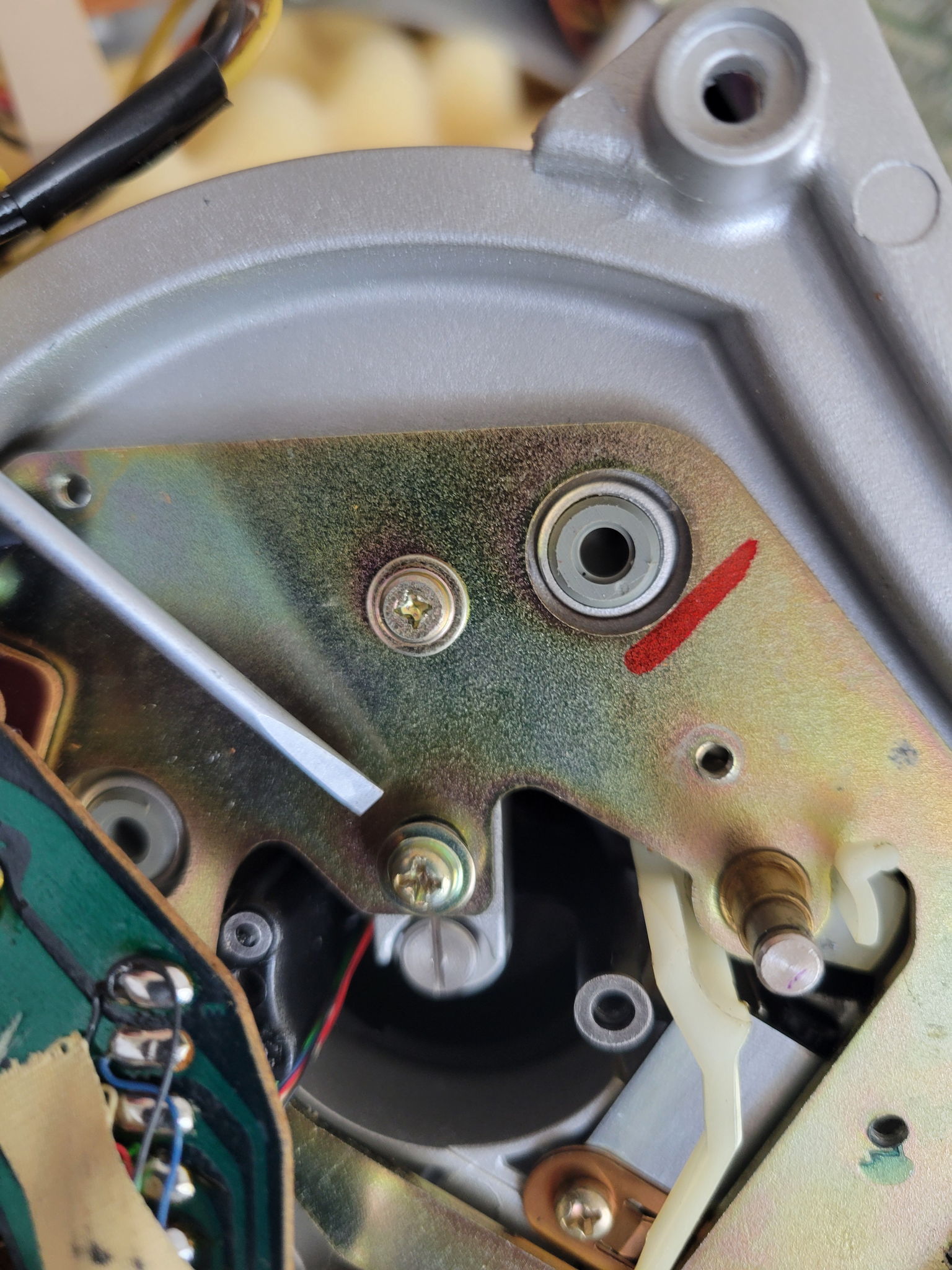 the second screw under the plate