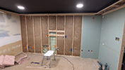 Insulation and drywall. Blocking in place for tv mounting.