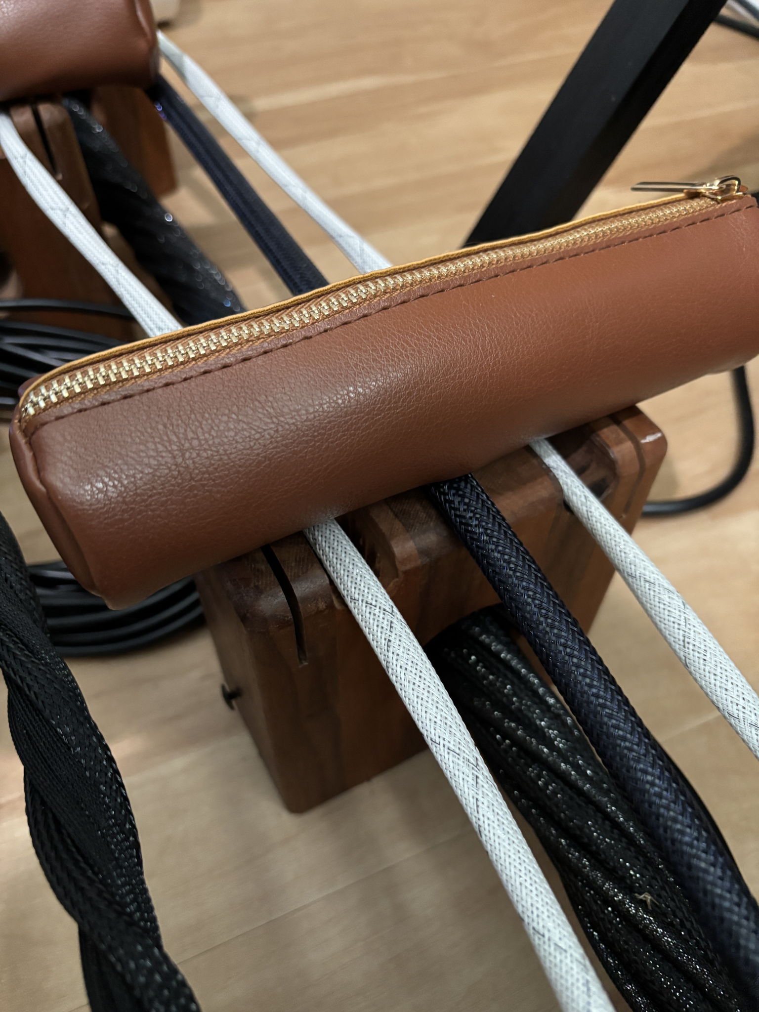Walnut lifter with leather pencil case filled with sand and 3/8" ball bearings