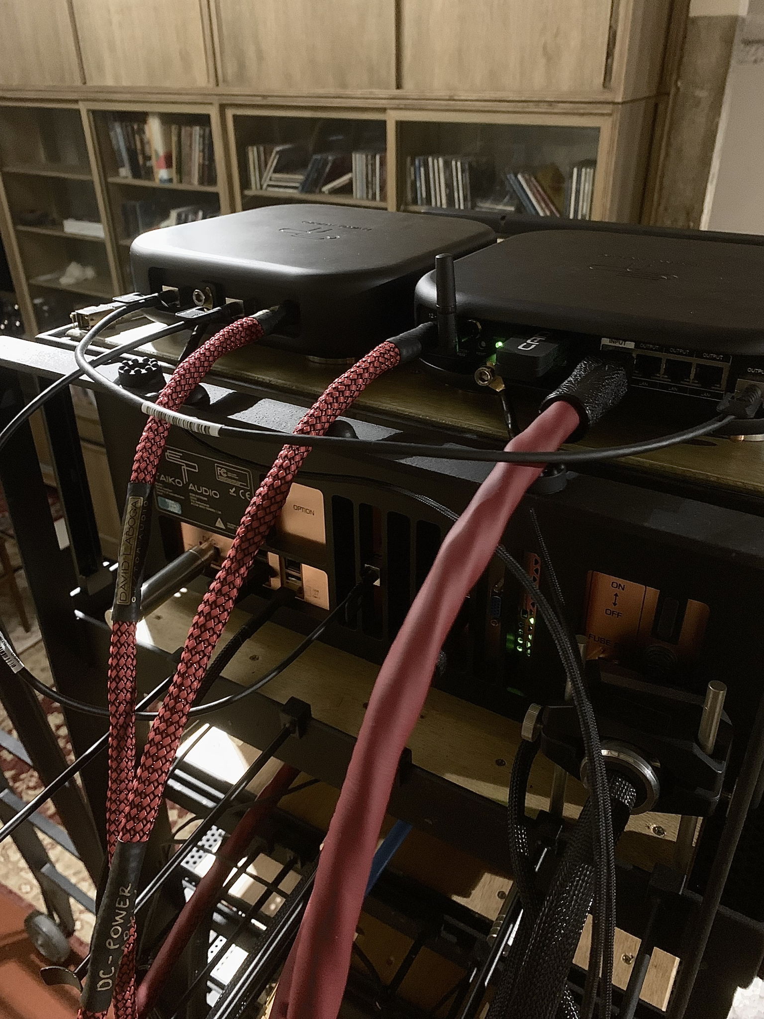 Taiko switch and router connected by generic DAC cables and the laboga ruby Ethernet cable to the asus satellite router, sitting top of the rack and fed by laboga dc power cables.