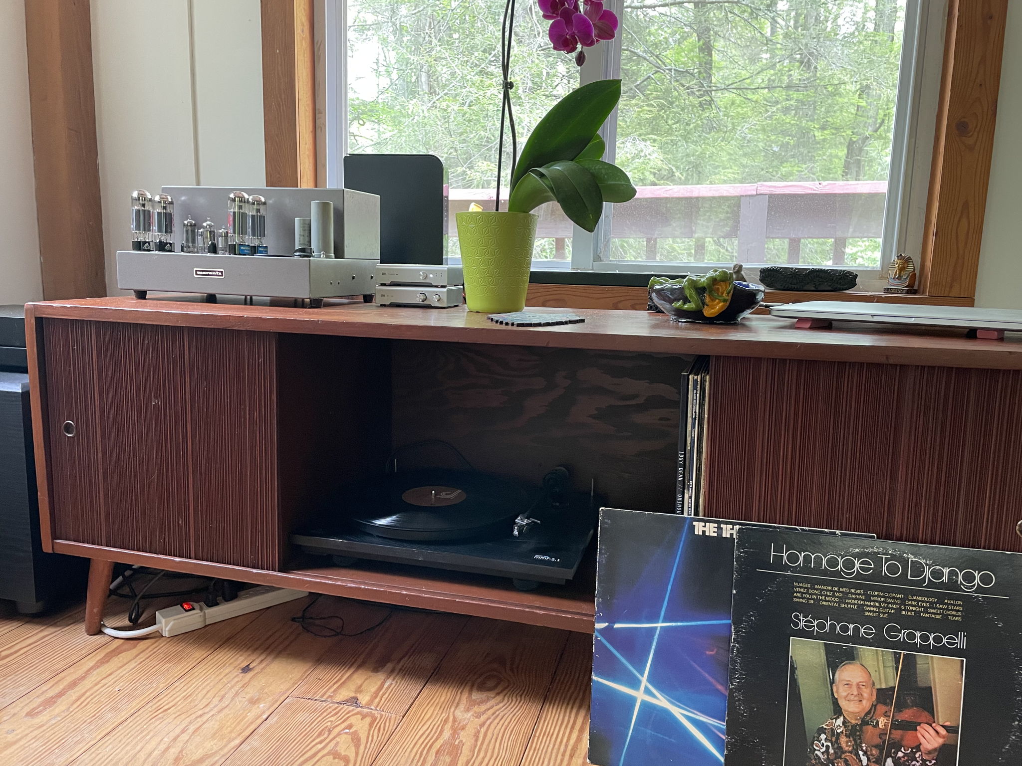 My TT sits in a cabinet; I close the doors when I'm spinning