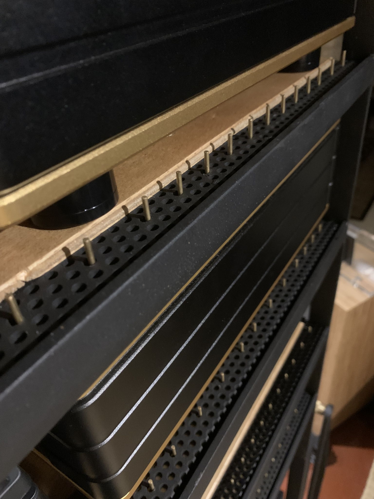 Customised perforated shelving with plywood sandwich damping on vertically sprung isolation.