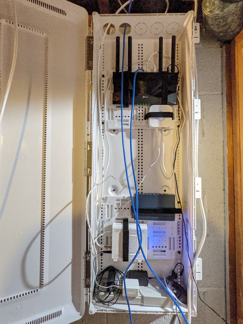 Wired up a structured panel so the wires all have somewhere to go. Still have to terminate and label all the Cat 6 wires with service loops, but it's functional now.