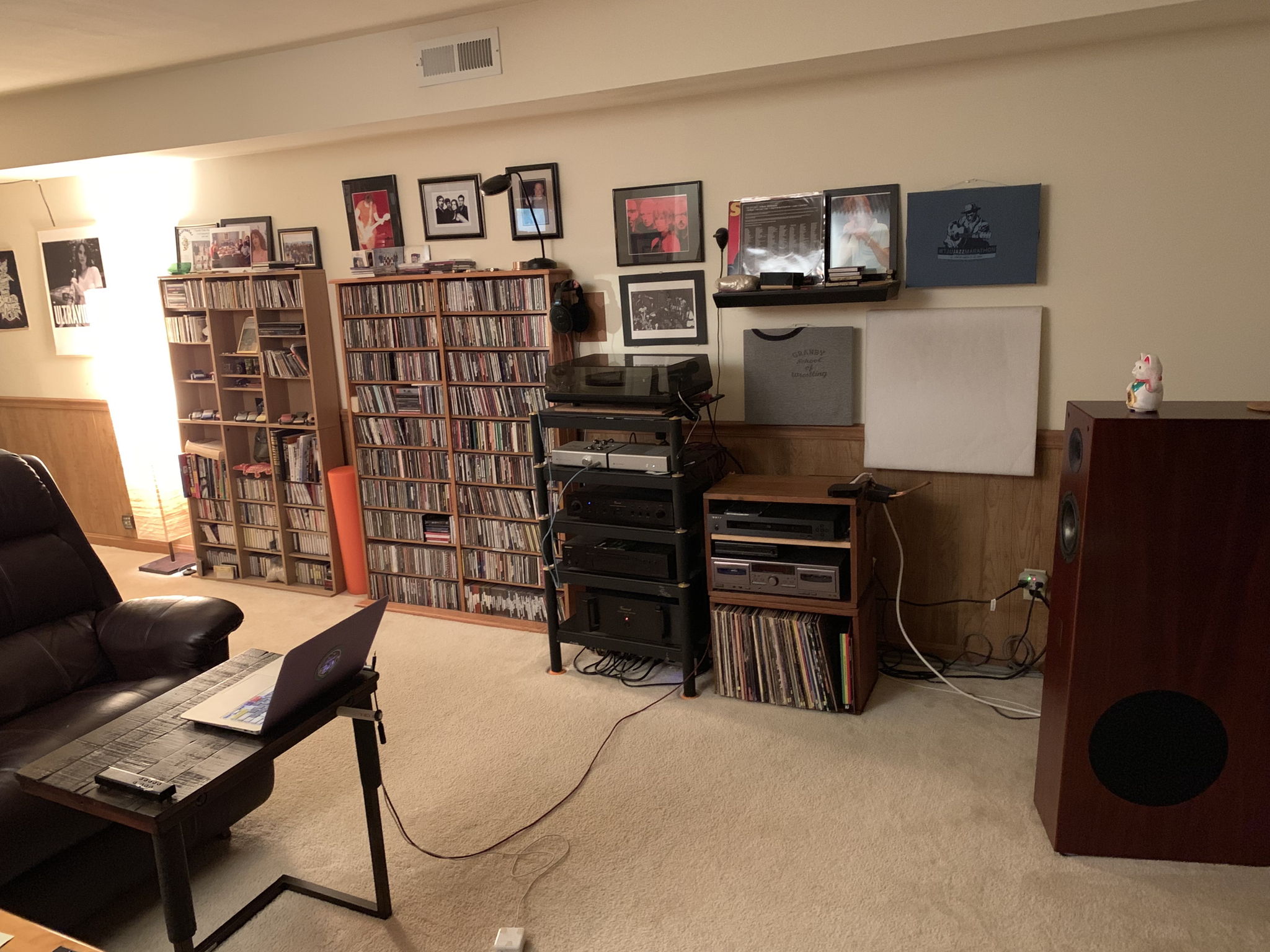 DIY absorbers behind speakers and at first reflection points (sides & ceiling). Back wall diffusion via bookcases.