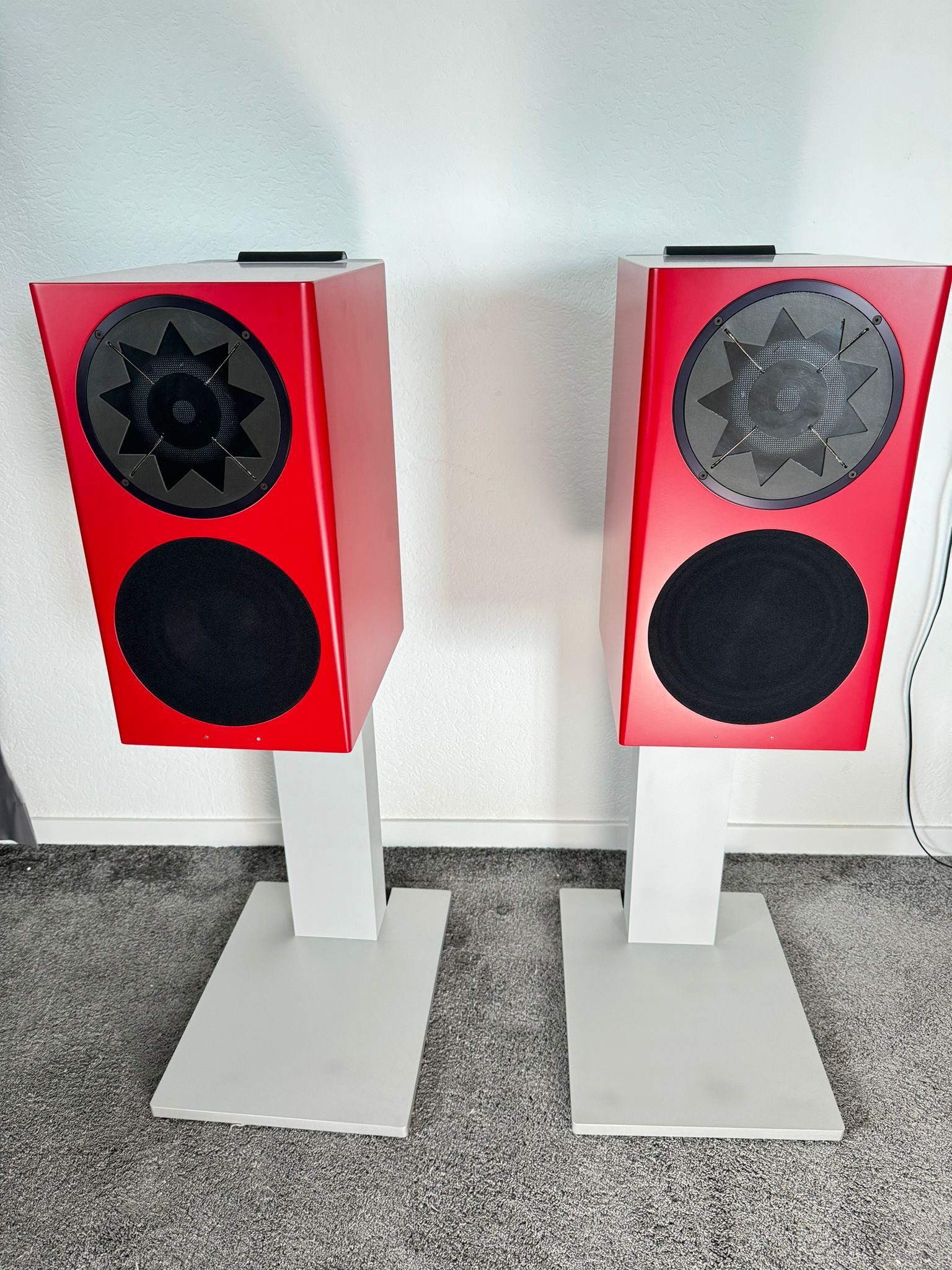 Manger GMBH MSMc1 speakers with stands in red