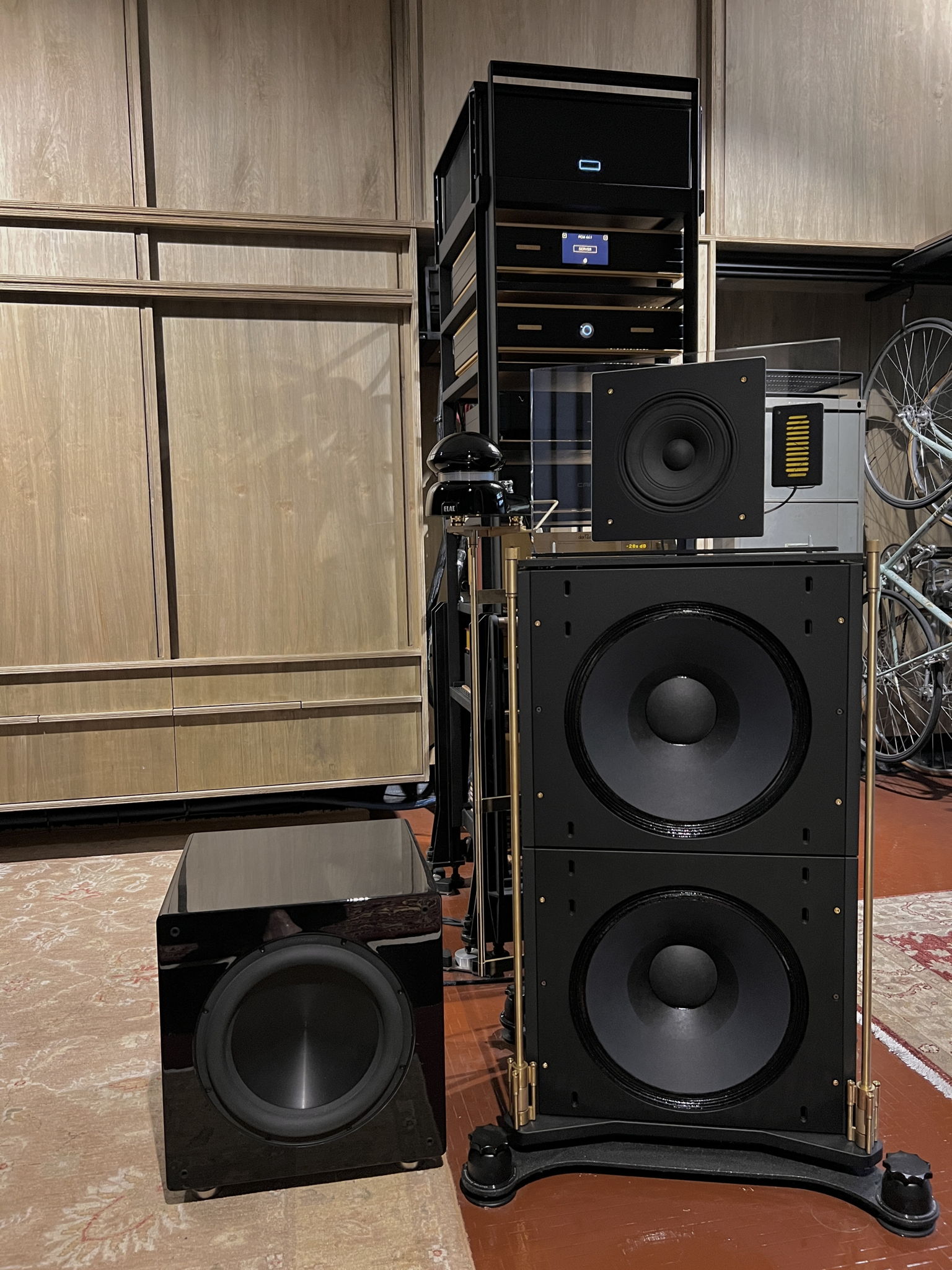 Front view of right speaker - the elac omni-directional tweeter sits on a custom brass armature, mounted onto the four threaded holes of the speaker base originally intended for its proprietary feet. The entire assembly sits on townshend isolation podiums to effect of more fleshed out realism and incisive bass.