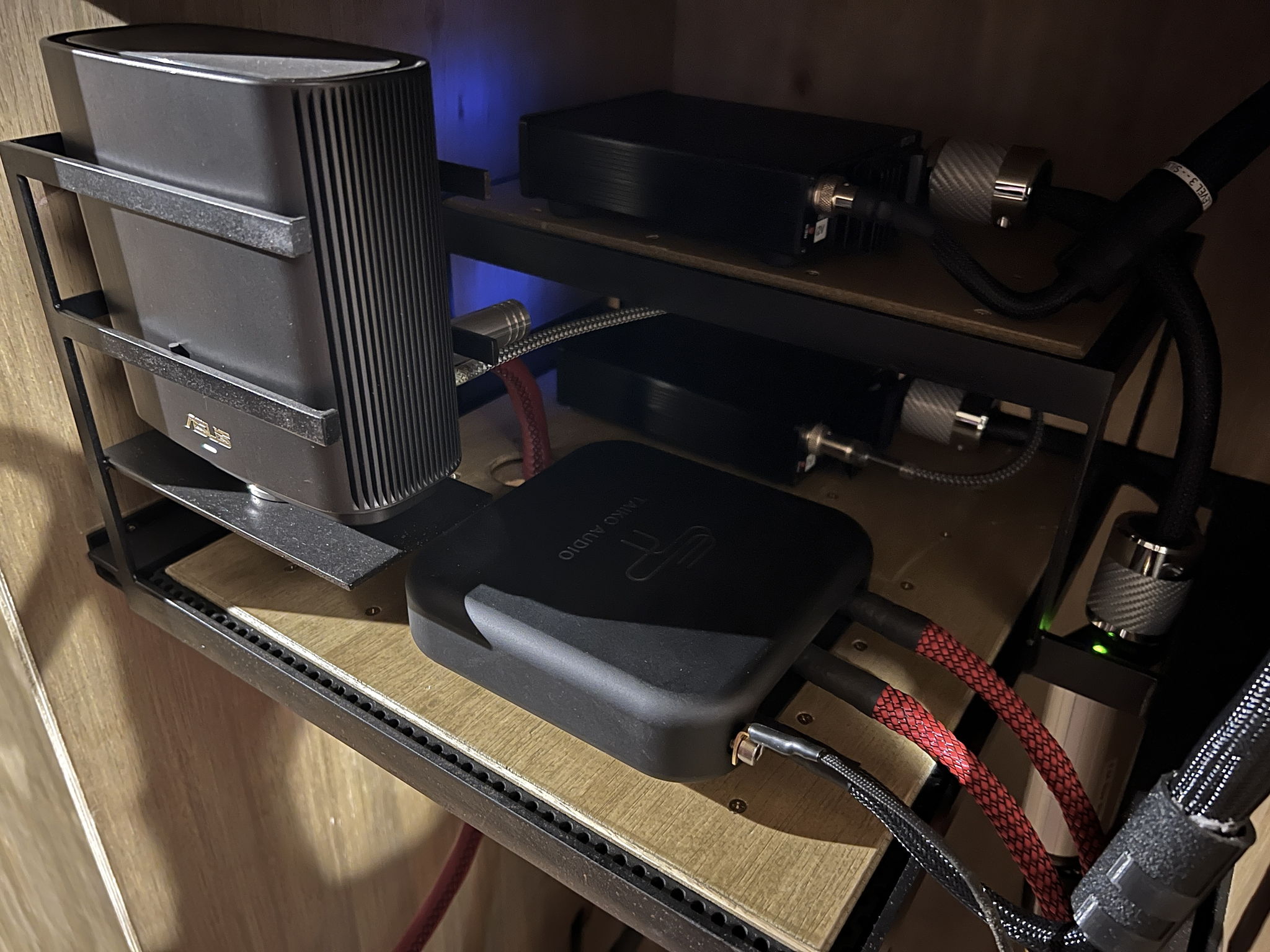 Incoming signal isolation platform, above the main power bank - with satellite router, dc power distributor, and accompanying farad linear power supplies, each fed by swiss digital fuse boxes - as with all other cabling, no power or signal cable comes into contact with any other cable.